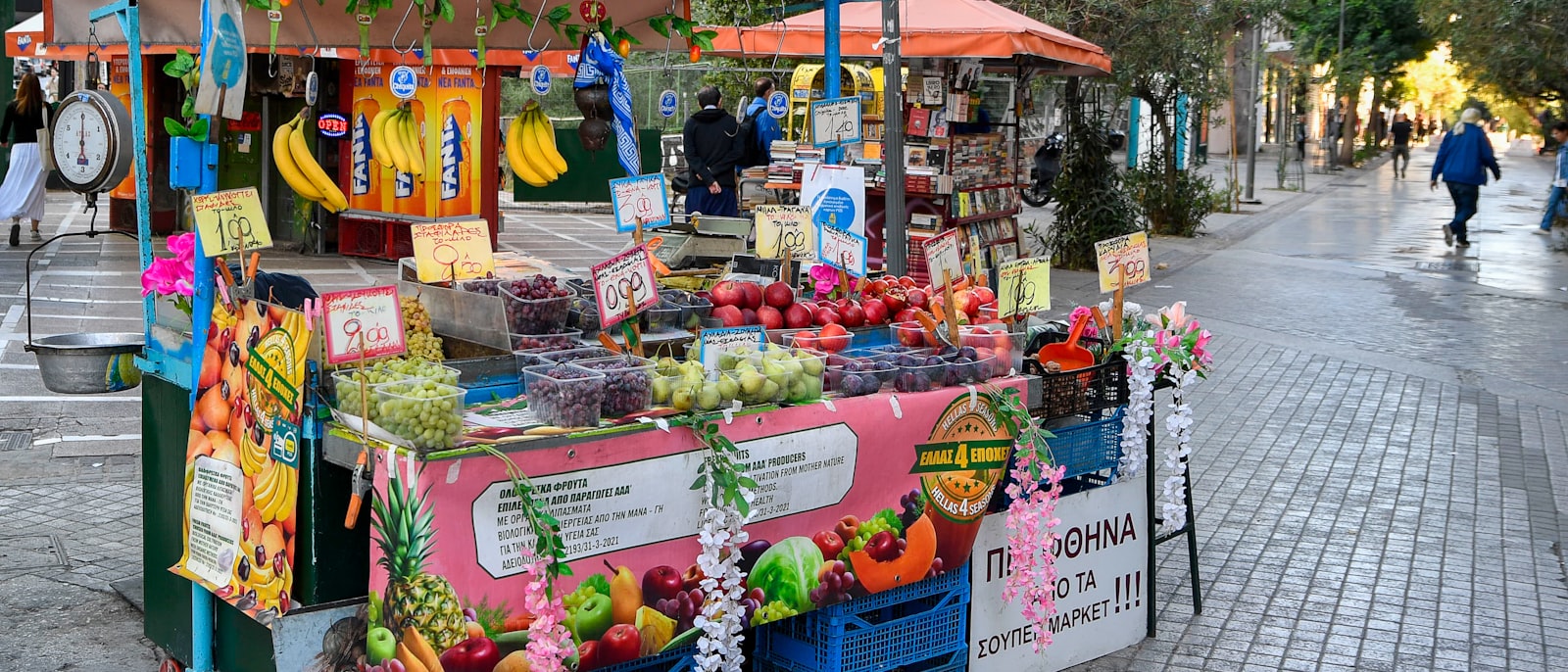 A vibrant street stand selling fresh fruits and vegetables